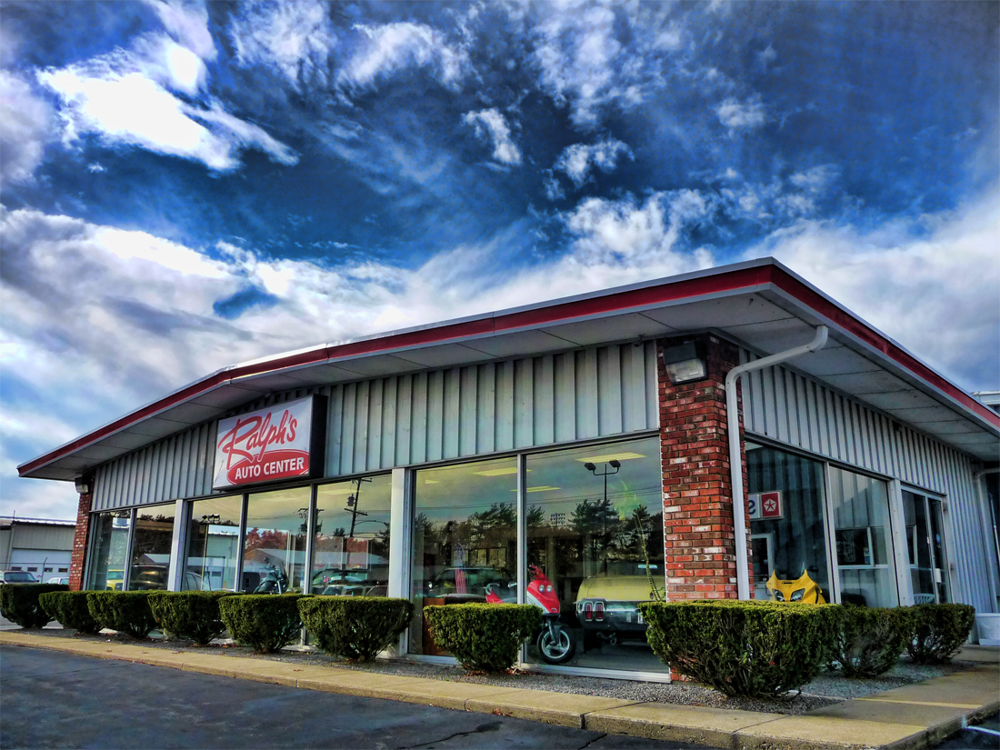 Ralph's Auto Center showroom and sign on Church Street